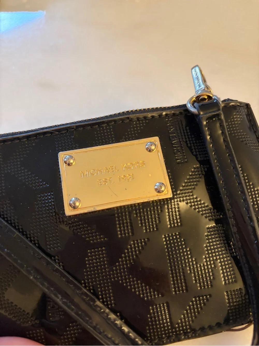 Michael Kors Black Patent Signature Wristlet with Gold Plate